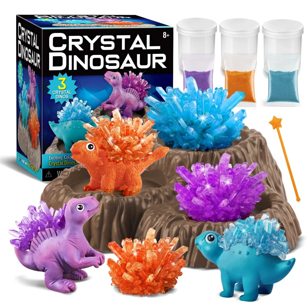 Crystal dinosaur growing kit manufactured by K&M — colorful crystal-covered dinosaur figures with growing containers and retail packaging